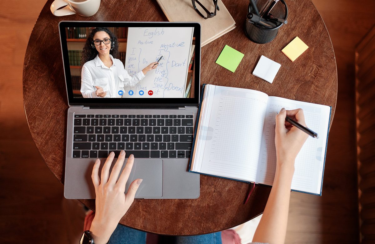 Remote learning setup with notebook and laptop