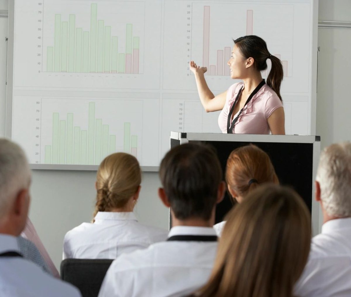 Woman presenting data to an audience