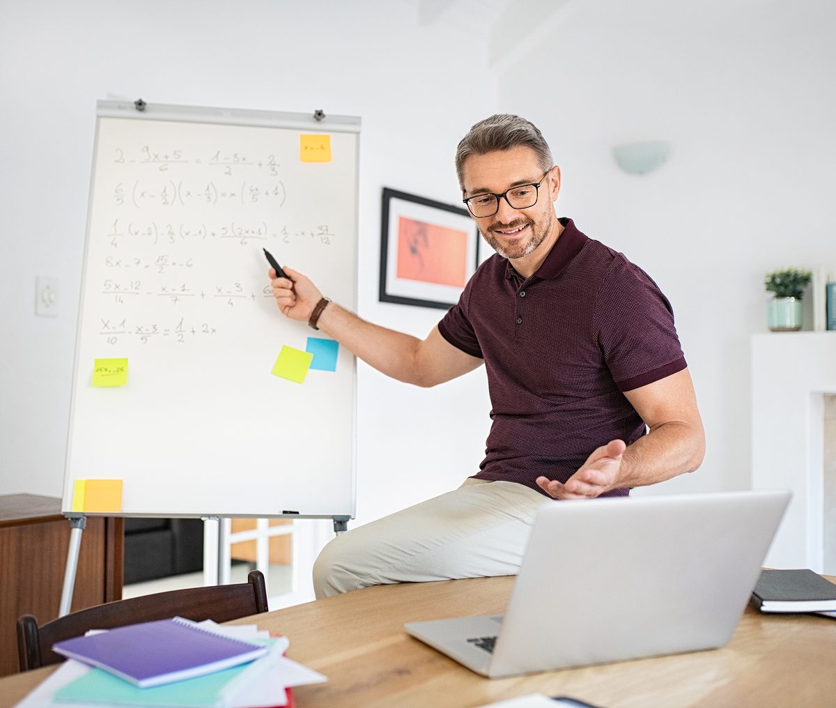 Man teaching math online with laptop